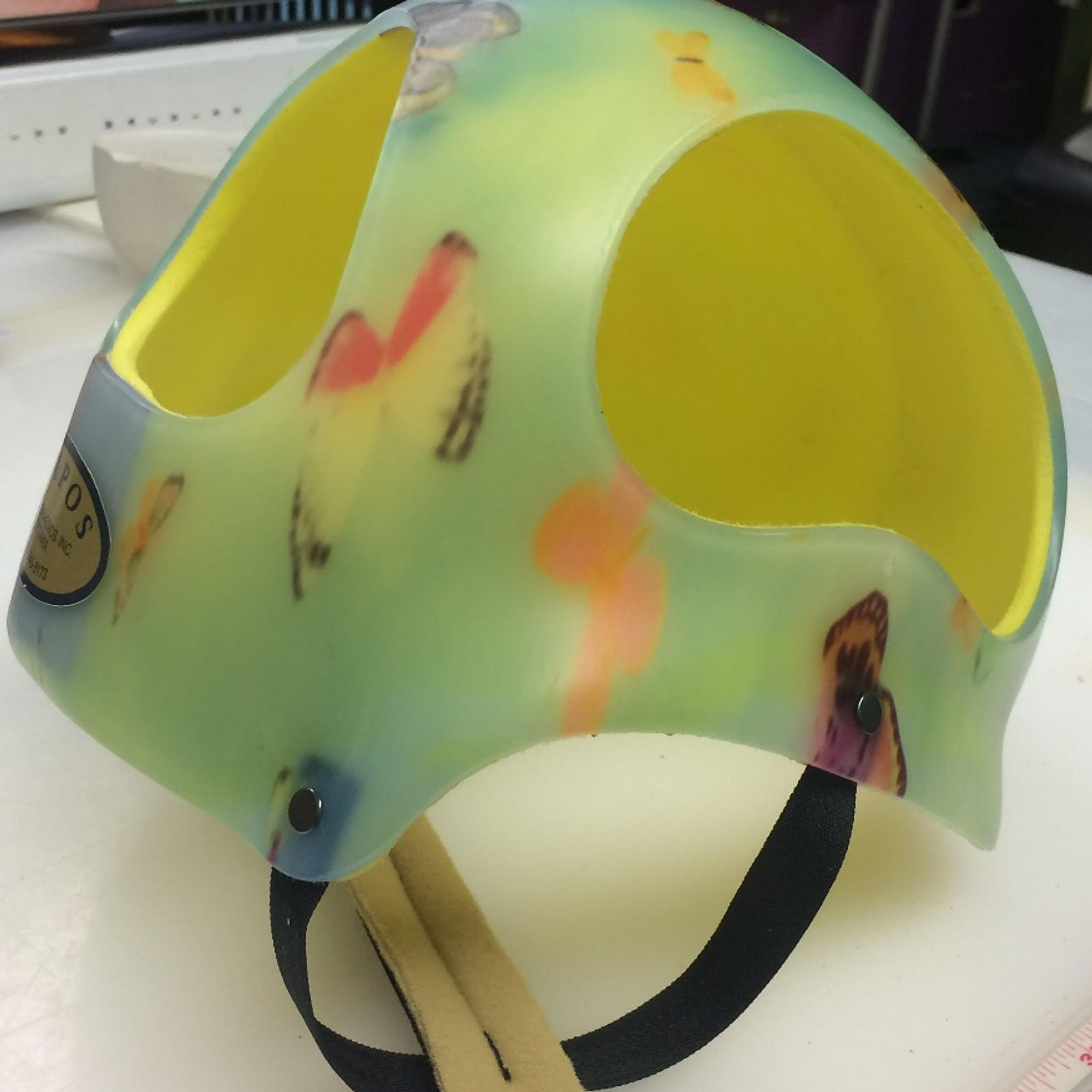 Helmet with blue butterflies pattern and yellow padding